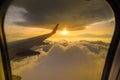 Beautiful sunset sky clouds seeing through the airplane window