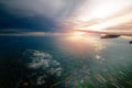 Beautiful sunset sky clouds seeing through the airplane windows. Royalty Free Stock Photo