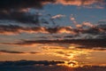 Beautiful sunset sky with dramatic clouds and twilight light, summer nature background Royalty Free Stock Photo