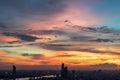 Beautiful sunset sky with dramatic light over large metropol city in Asia. Beautiful blazing sunset landscape Royalty Free Stock Photo