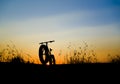 Beautiful sunset sky and Mountain bike silhouette Royalty Free Stock Photo