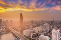 Beautiful sunset sky over Bangkok city river curved aerial view