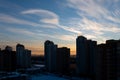 Beautiful sunset sky over dark cityscape