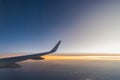 Beautiful sunset, sky on the top view, airplane flying view from inside window aircraft of Traveling Royalty Free Stock Photo