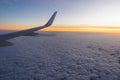 Beautiful sunset, sky on the top view, airplane flying view from inside window aircraft of Traveling Royalty Free Stock Photo