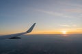Beautiful sunset, sky on the top view, airplane flying view from inside window Royalty Free Stock Photo