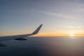 Beautiful sunset, sky on the top view, airplane flying view from inside window aircraft of Traveling.. Sunlight and flare Royalty Free Stock Photo