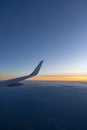Beautiful sunset, sky on the top view, airplane flying view from inside window aircraft of Traveling.. Sunlight and flare Royalty Free Stock Photo