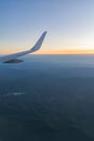Beautiful sunset, sky on the top view, airplane flying view from inside window aircraft of Traveling vertical image Royalty Free Stock Photo