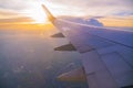 Beautiful sunset, sky on the top view, airplane flying view from inside window and cloud, sun down background. Royalty Free Stock Photo