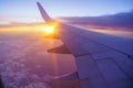 Beautiful sunset, sky on the top view, airplane flying view from inside window and cloud, sun down background. Royalty Free Stock Photo