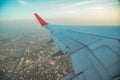 Beautiful sunset, sky on the top view city, airplane flying view from inside window aircraft. Royalty Free Stock Photo