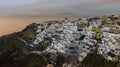 Beautiful sunset skyline view in Oia town on Santorini island, Greece. Traditional white architecture and greek orthodox churches Royalty Free Stock Photo