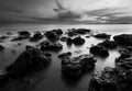 Beautiful sunset at the stone beach in black and white Royalty Free Stock Photo