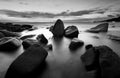 Beautiful sunset at the stone beach in black and white Royalty Free Stock Photo