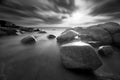 Beautiful sunset at the stone beach in black and white Royalty Free Stock Photo