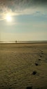 Beautiful sunset stroll on the beach in summer