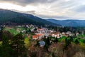 Beautiful sunset with sun beams through the clouds over the mountains Royalty Free Stock Photo