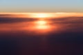 Beautiful sunset or sunrise above clouds from airplane perspective Royalty Free Stock Photo