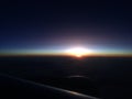 Beautiful sunset or sunrise sky above clouds with dramatic light. view from airplane Royalty Free Stock Photo