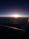 Beautiful sunset or sunrise sky above clouds with dramatic light. view from airplane Royalty Free Stock Photo