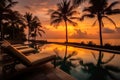 Beautiful sunset swimming pool in hotel resort , Silhouette luxury swimming pool with palm trees beach at night sunset time.