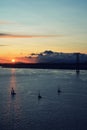 Beautiful sunset. Tejo river. Portugal. April bridge. Lisbon. Almada. Boat boats water sun sky clouds wonderful bright light