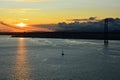 Beautiful sunset. Tejo river. Portugal. April bridge. Lisbon. Almada. Boat boats water sun sky clouds wonderful bright light