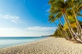 Beautiful sunset on the tropical beach on Boracay island, Philippines. Coconut palm trees, sea, sailboat and white sand. Nature Royalty Free Stock Photo