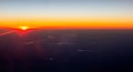 Beautiful sunset view from an airplane over land Royalty Free Stock Photo