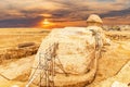 Beautiful sunset view on the back sight of the Great Sphinx and the buildings of Giza, Egypt Royalty Free Stock Photo