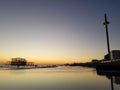 Beautiful sunset view at Brighton Pier with Brighton beach sea, sand and the highest and tallest building in the background. Royalty Free Stock Photo