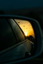 A beautiful sunset view through car mirror