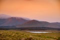 Beautiful sunset view of Connemara. Scenic Irish countryside landscape with magnificent mountains on the horizon, County Galway, I Royalty Free Stock Photo