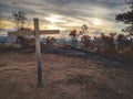 A cross on the top of the hill before the sunset fall. Royalty Free Stock Photo