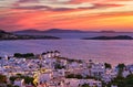 Beautiful sunset view of famous traditional white windmills on hilltop, Mykonos, Greece. Whitewashed house, colorful Royalty Free Stock Photo