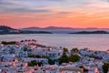 Beautiful sunset view of famous white windmills on hill top, Mykonos, Greece. Colorful sunset sky, summer, iconic Royalty Free Stock Photo