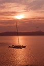 Beautiful sunset view over Palma bay with moored sailboat and airplane Royalty Free Stock Photo