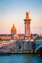 Beautiful sunset view on Pont Alexandre III and Les Invalides in Paris, France Royalty Free Stock Photo
