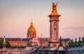 Beautiful sunset view on Pont Alexandre III and Les Invalides in Paris, France Royalty Free Stock Photo