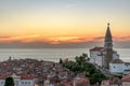 Beautiful sunset view of Venetian-style buildings in Piran with the Adriatic sea in the background Royalty Free Stock Photo