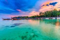 Beautiful sunset on white sand beach and Clear water to see the coral reef at Koh Lipe island in Satun,Thailand Royalty Free Stock Photo