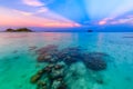 Beautiful sunset on white sand beach and Clear water to see the coral reef at Koh Lipe island in Satun,Thailand Royalty Free Stock Photo