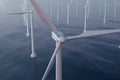 Beautiful sunset wind turbines in sea, ocean. Clean energy, wind energy, ecological concept. 3d rendering Royalty Free Stock Photo