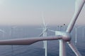 Beautiful sunset wind turbines in sea, ocean. Clean energy, wind energy, ecological concept. 3d rendering Royalty Free Stock Photo