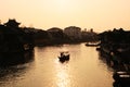 Beautiful sunset in Zhujiajiao ancient town, China. Traditional chinese arhitecture, ships on water, river