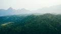 Beautiful sunshine at misty morning mountains of Thailand. Rainforest ecosystem and healthy environment concept background, Royalty Free Stock Photo