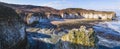 Beautiful sunshine shining over Flamborough Head white chalk cliffs. Panoramic view. Touristic destination concept.