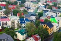 Beautiful super wide-angle aerial view of Reykjavik, Iceland with harbor and skyline mountains and scenery beyond the city, seen f