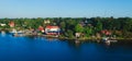 Beautiful super wide-angle aerial view of Stockholm archipelago skerries and suburbs with classic sweden scandinavian designed cot